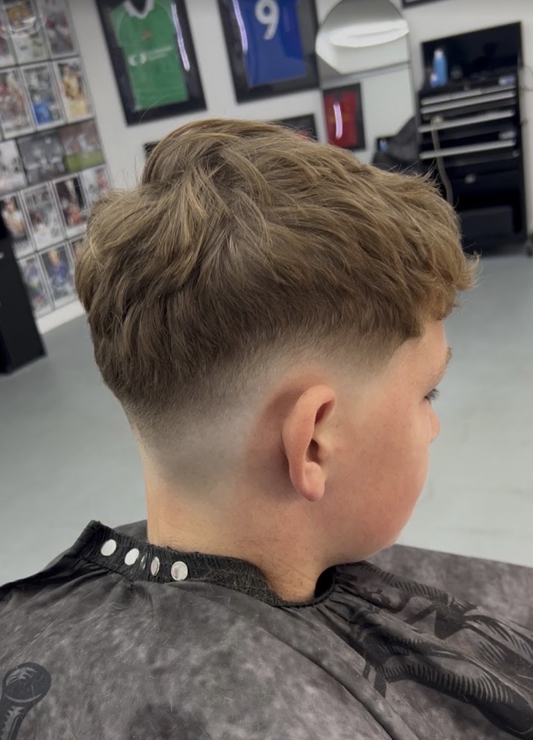 Children's textured haircut with a skin fade